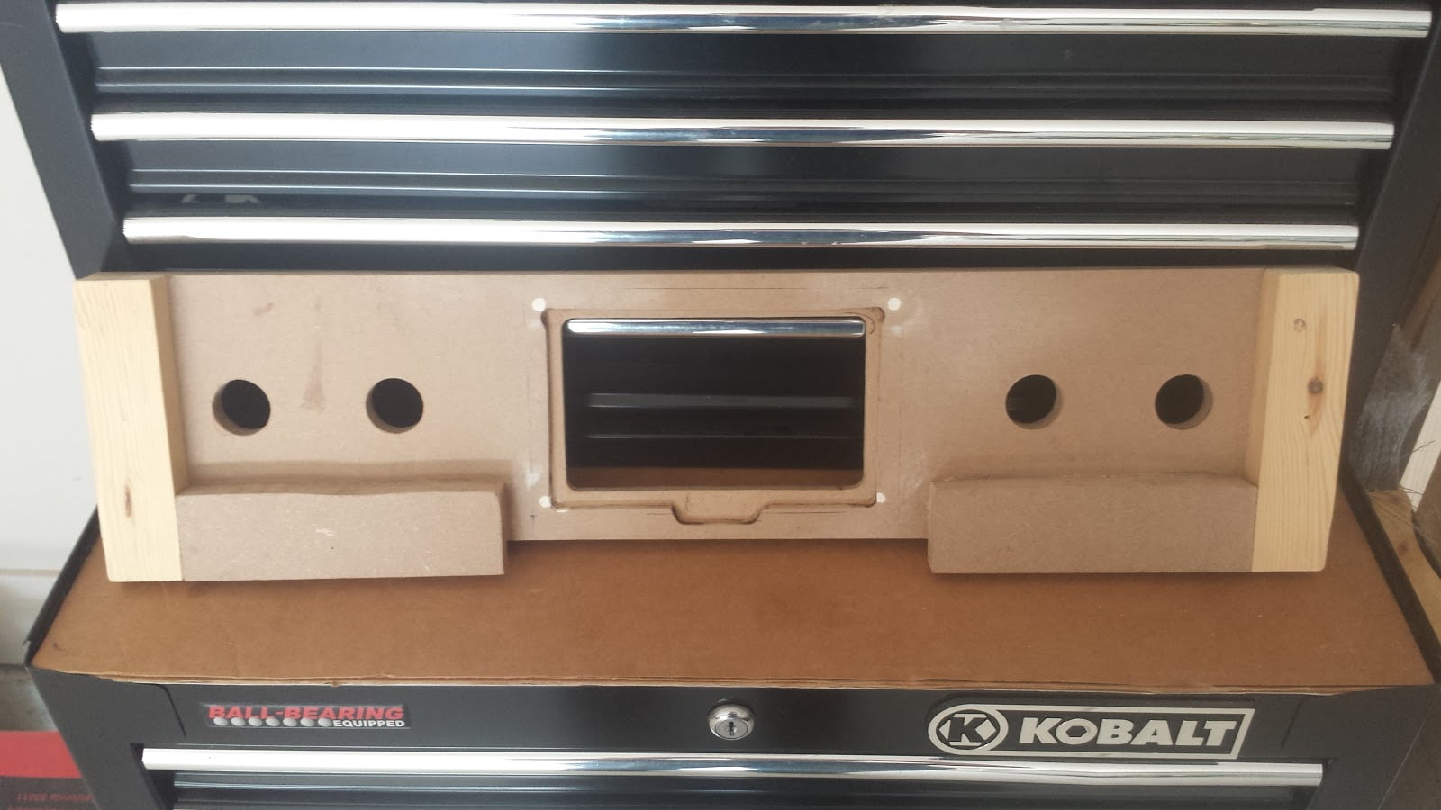 Rear view of the arcade administration panel. Furring strips are added on the bottom and left/right. An indentation is routed around the screen area, so the screen can be inlaid in this indent.